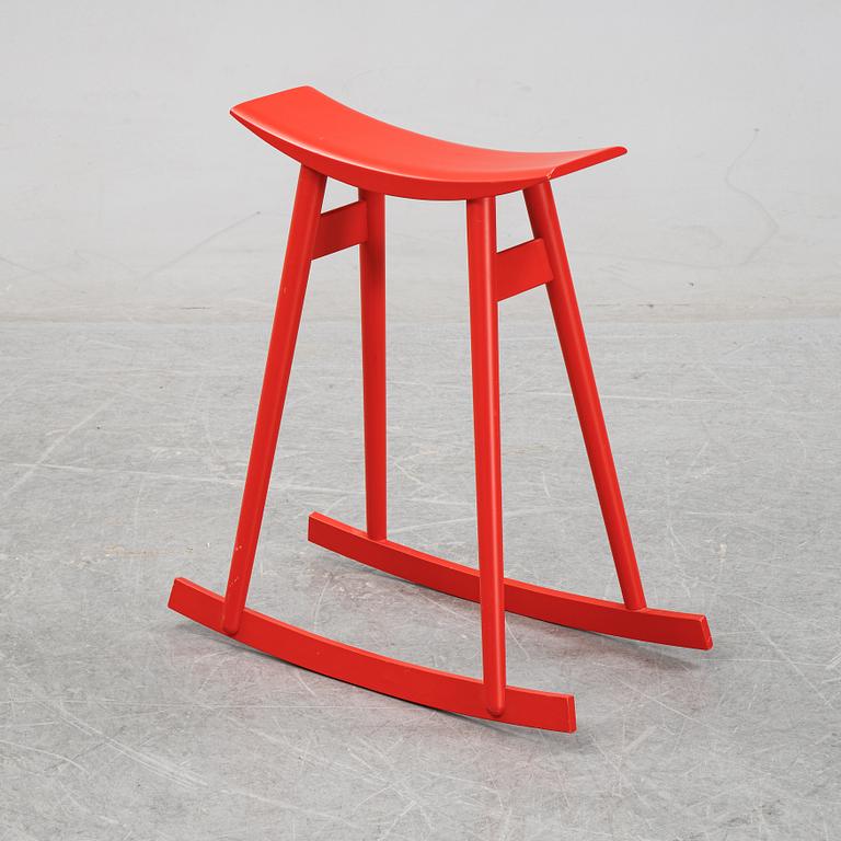 Per Sundstedt, a wood rocking stool from Pyra, Sweden.