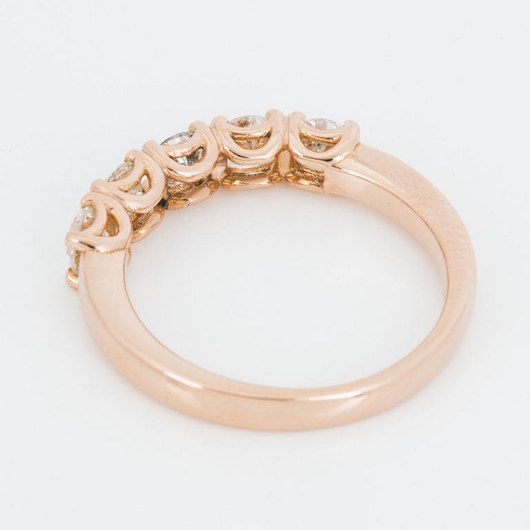 An 18K rose gold ring set with round brilliant-cut diamonds.