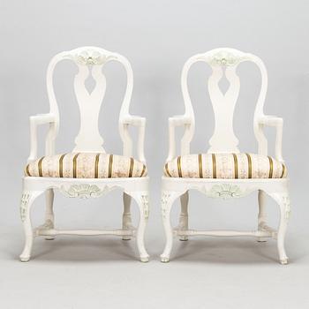 A pair of Rococo style armchairs, a pair of chairs, and a table, mid 20th century.