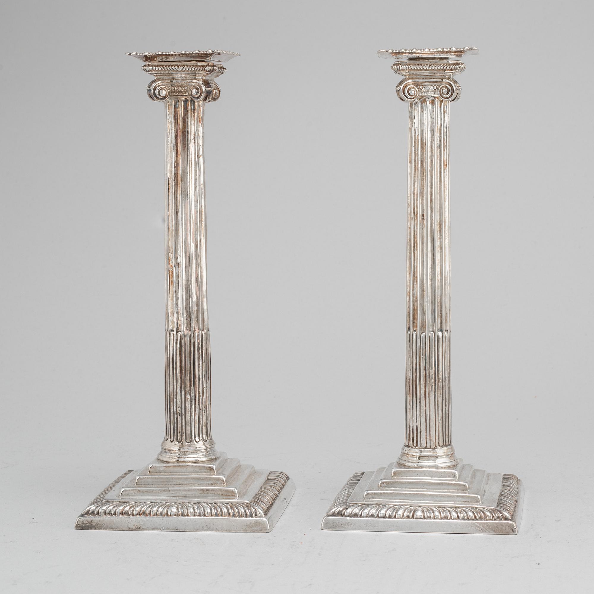 A pair of English 18th century silver candlesticks, worn marks, London.