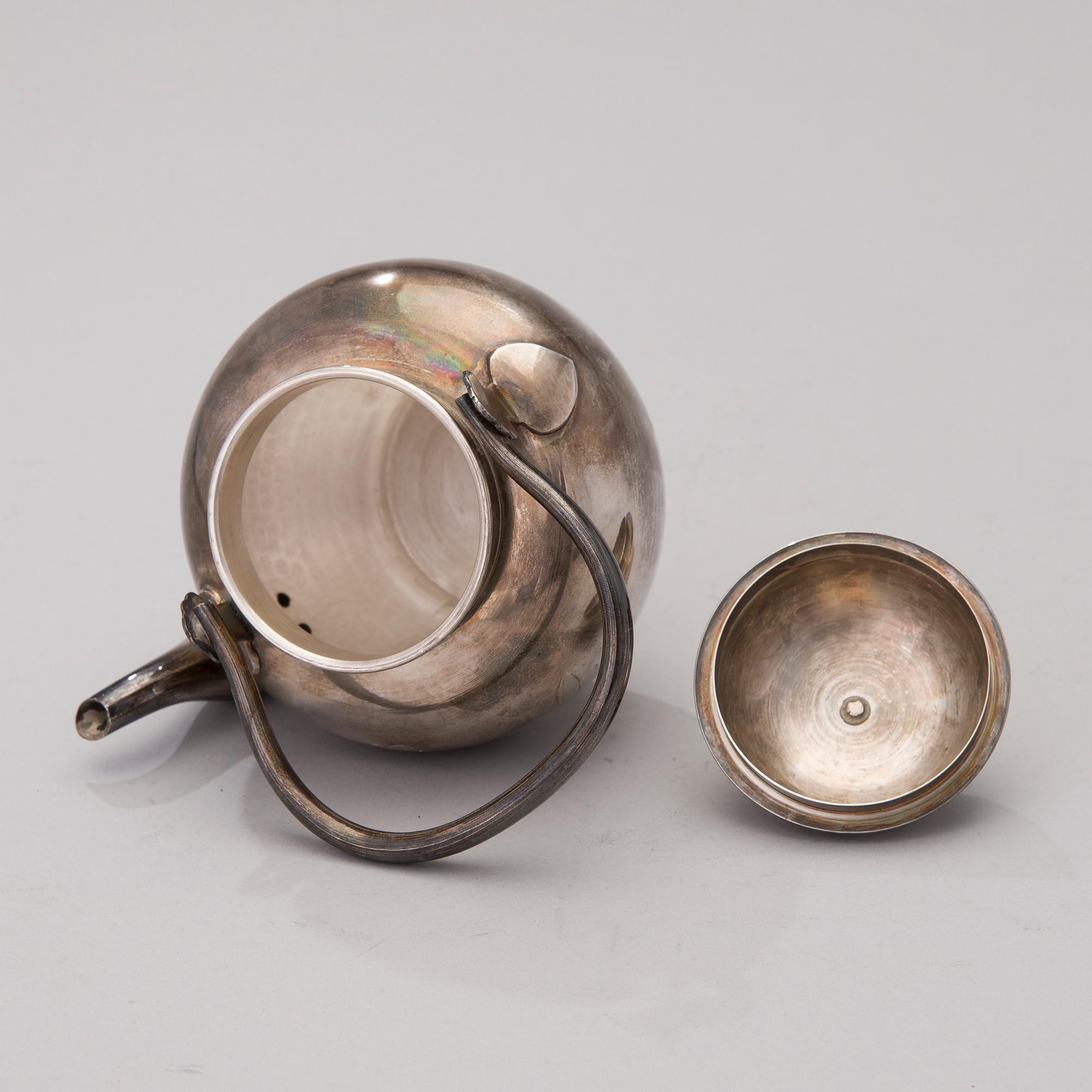 A Korean Silver Tea Pot.