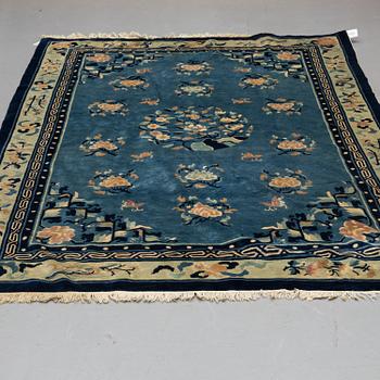 A CARPET, an old China, "antique finish", ca 270,5-273,5 x 181-186 cm (as well as ca 1 cm flat weave at the sides).