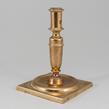 A 17th century bronze candlestick.