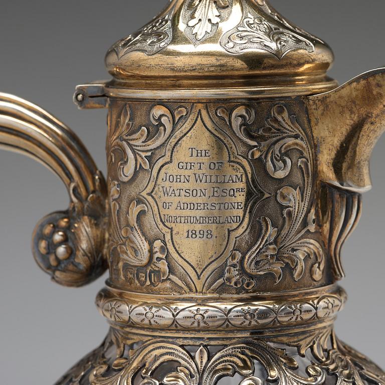 An English 19th century silver-gilt and glass wine-jug, marked Hunt & Roskell Late Storr & Mortimer, London 1895.