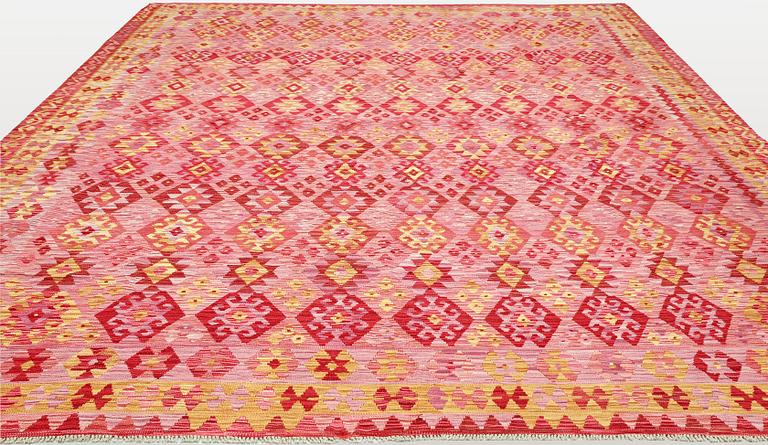 A Kilim carpet, approx. 384 x 317 cm.