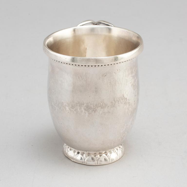 GEORG JENSEN,  a 830/1000 silver mug and  a bowl (a christening set), Copenhagen ca 1918-1927, design nr 127, 158.