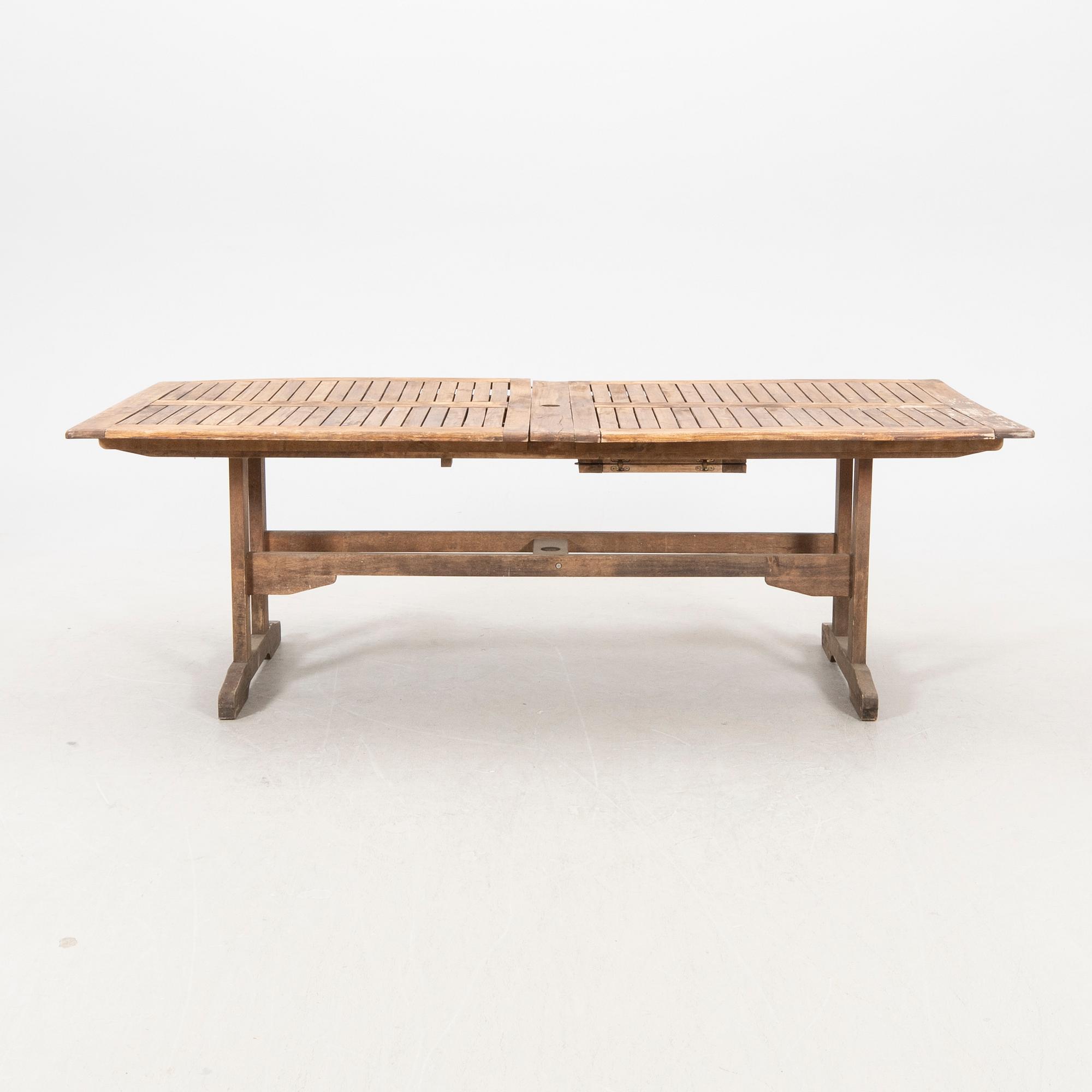 A 9 pcs stained teak garden suite by Brafab around 2000.