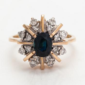 A 14K gold ring with diamonds ca. 0.40 ct in total and a sapphire. Finland 1995.