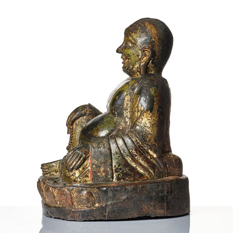 A large seated bronze figure of Budai, Ming Dynasty, dated to the fifth year of Jiajing (1526).