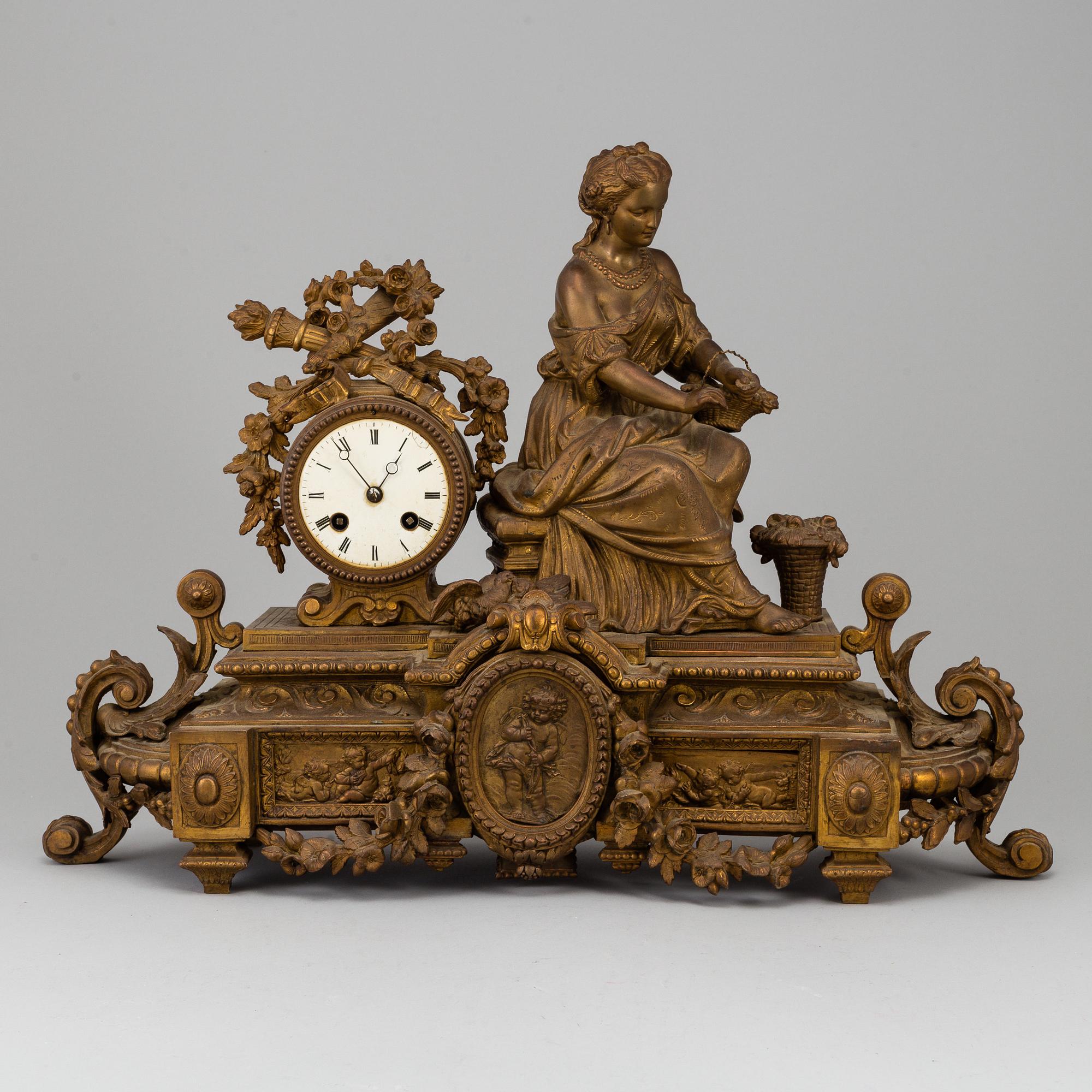 A  French 19th century mantle clock in Louis-XVI style.