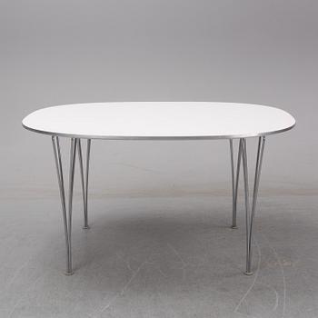 A 'Superelliptic' table by Bruno Mathsson & Piet Hein for Fritz Hansen, dated 2002.