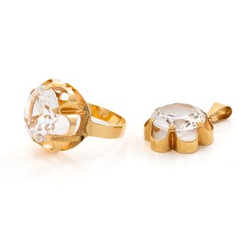 Ring and pendant, 18K gold with synthetic white stones.