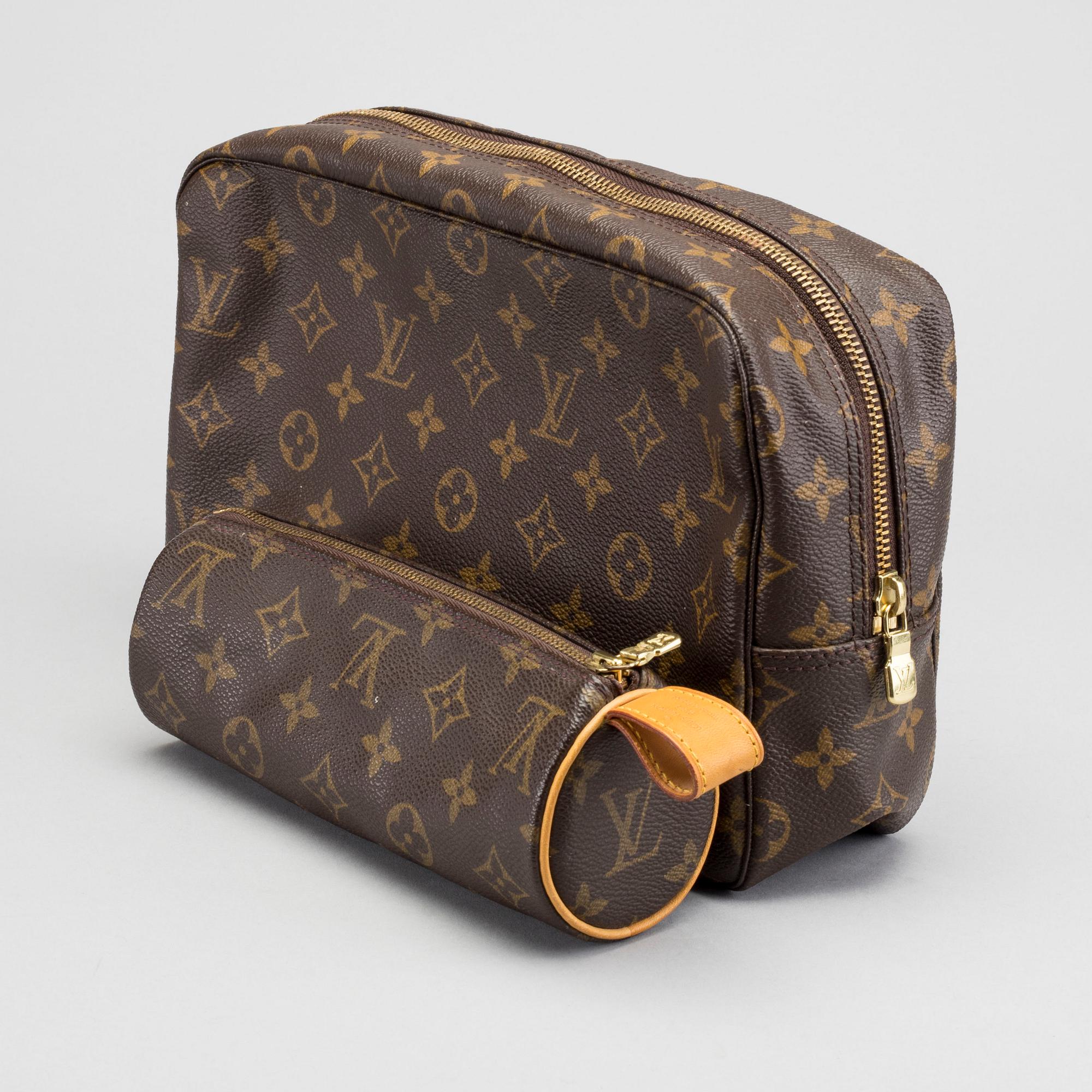 A LOUIS VUITTON TOILET POUCH and PENCIL CASE.