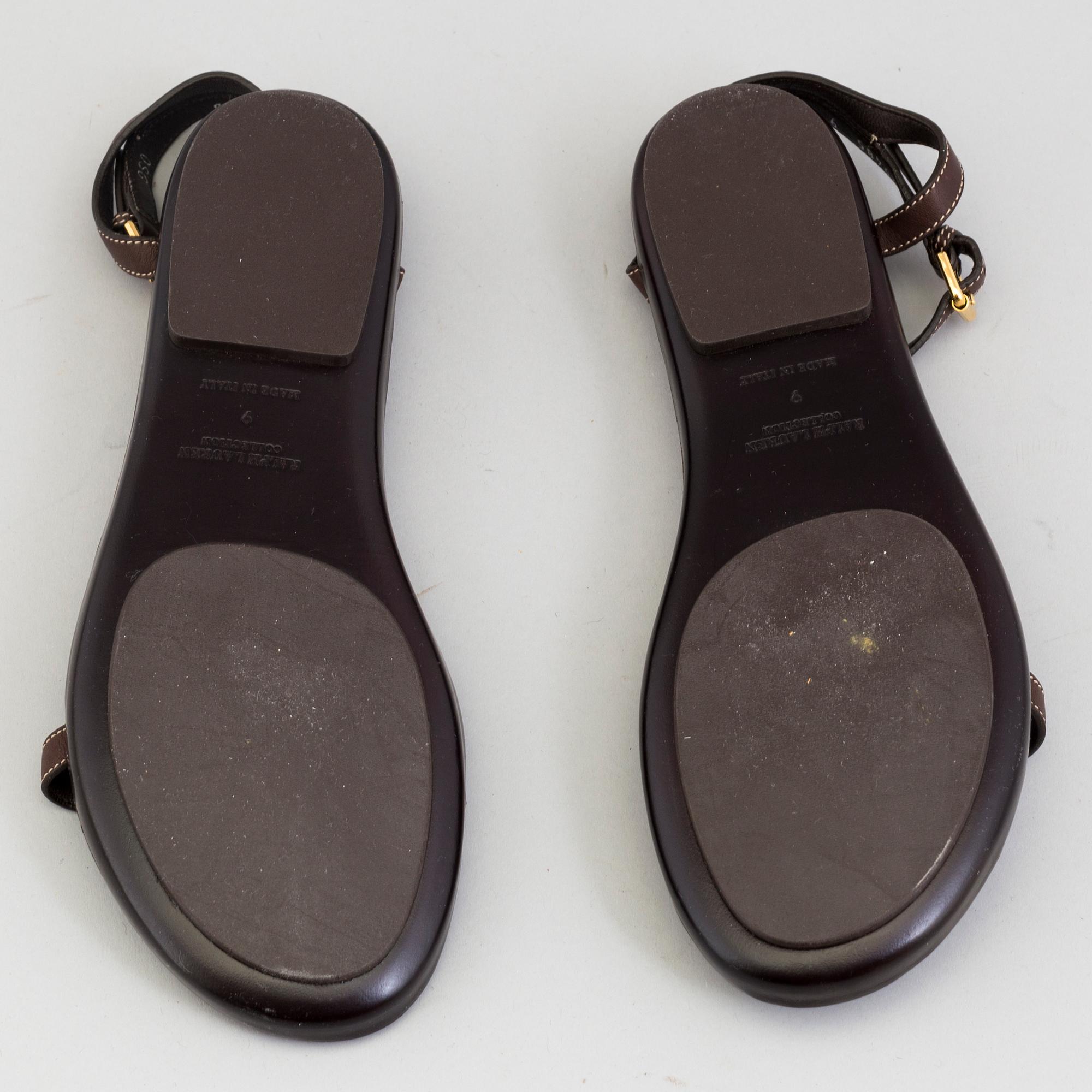 A pair of darkbrown leather sandals by Ralph Lauren.