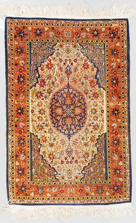 A rug, Old silk Hereke, ca 136 x 92 cm.