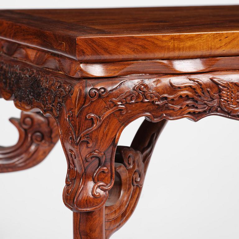 A Chinese huali square table with a lotus-leaf waist, 20th century.