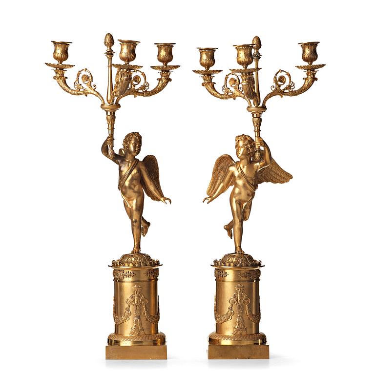 A pair of French Empire three-light candelabra, early 19th century.