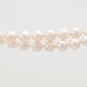 A two row cultured pearl necklace with 14K gold clasp.