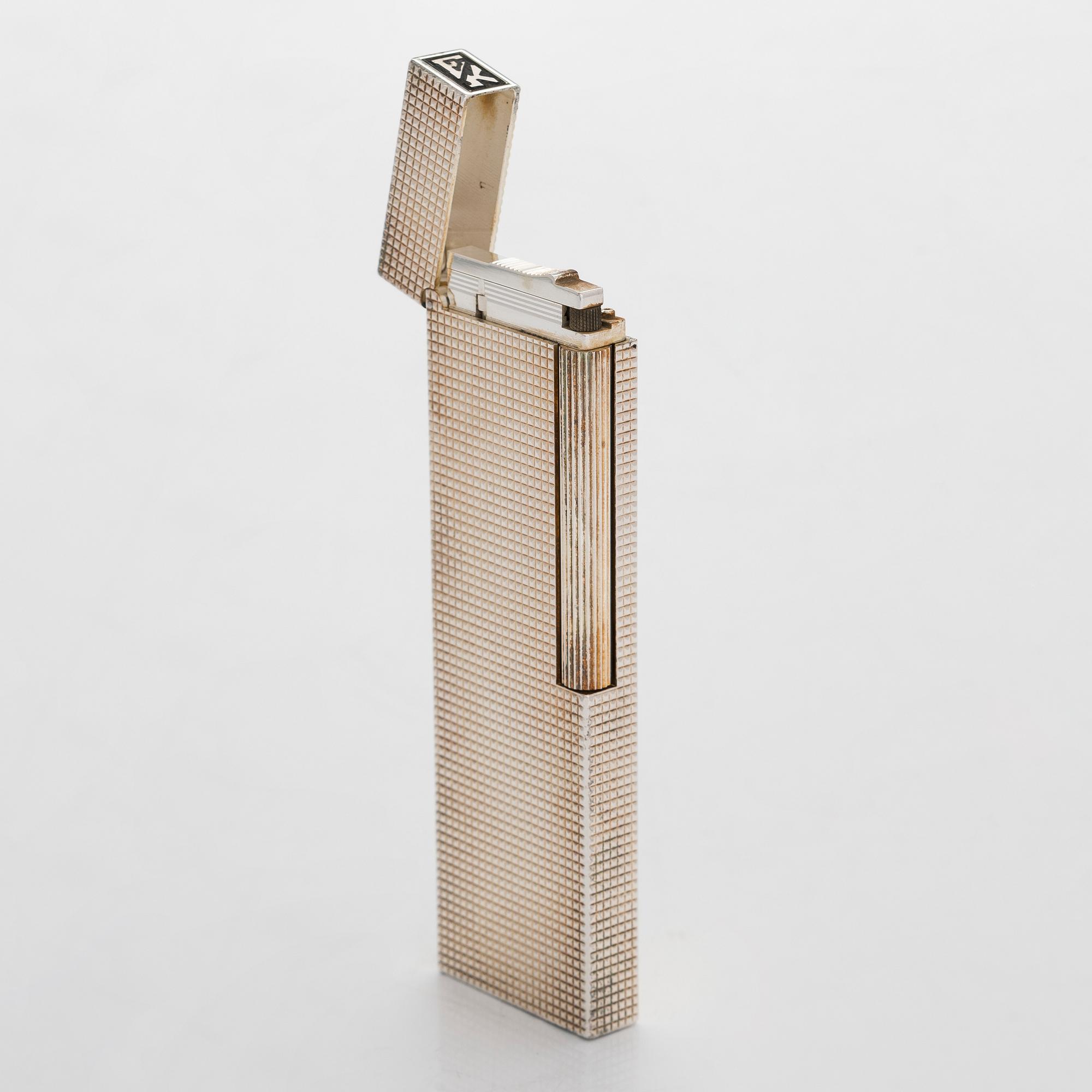 S.T. Dupont, a late 20th century table lighter.