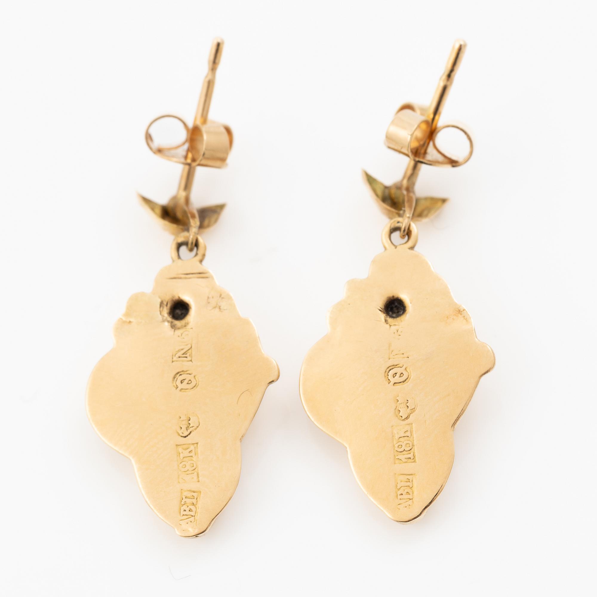A pair of 18K gold earrings.