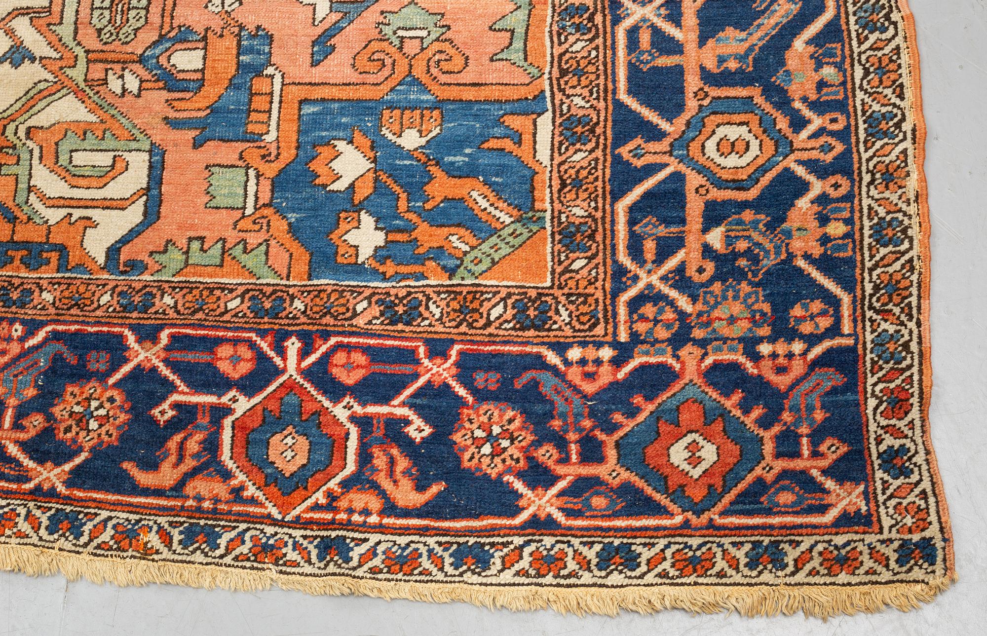 A carpet, an antique Heriz, ca 469,5-471 x 300-309,5 cm.