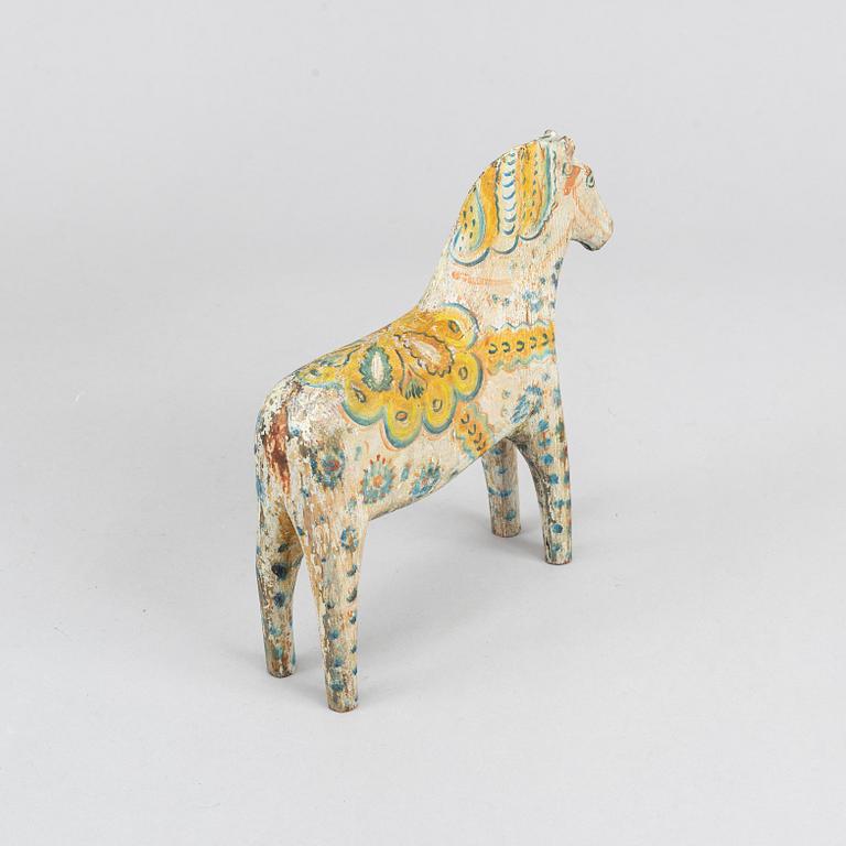 A painted Swedish wooden horse from the first half of the 20th century.