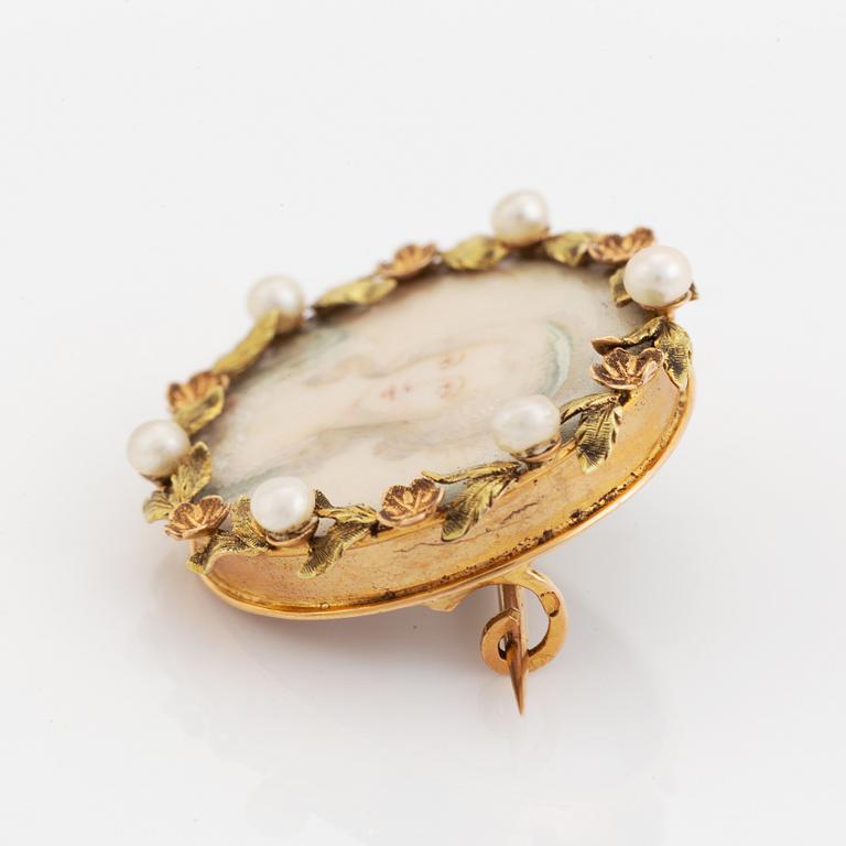 Brooch with miniature portrait on mother of pearl.