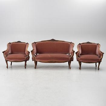 Sofa, 2 armchairs, 4 chairs, table and banquet, Rococo style, 20th century.