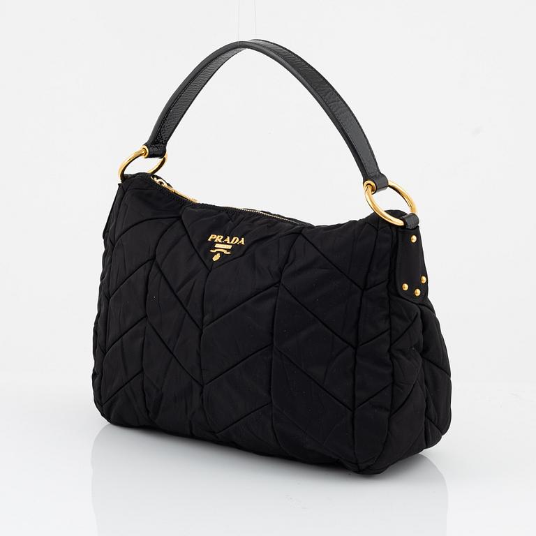 Prada, a black nylon bag.