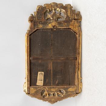 A Swedish rococo two-branch girandole mirror, Stockholm, later part 18th century.