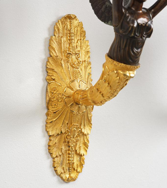 A pair of French Empire five-branch gilt and patinated bronze appliques, first part 19th century.