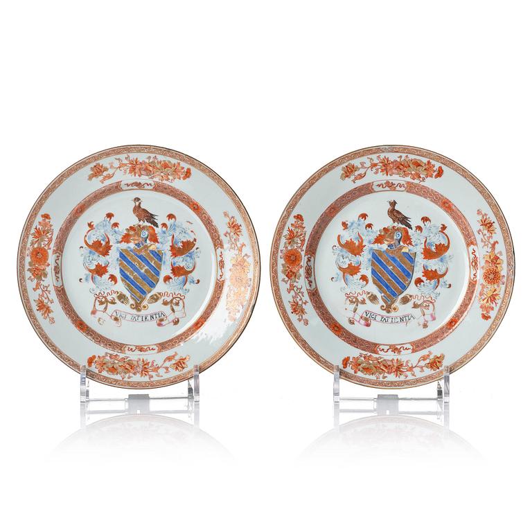 A pair of iron red decorated armorial dishes, Qing dynasty, 18th century.