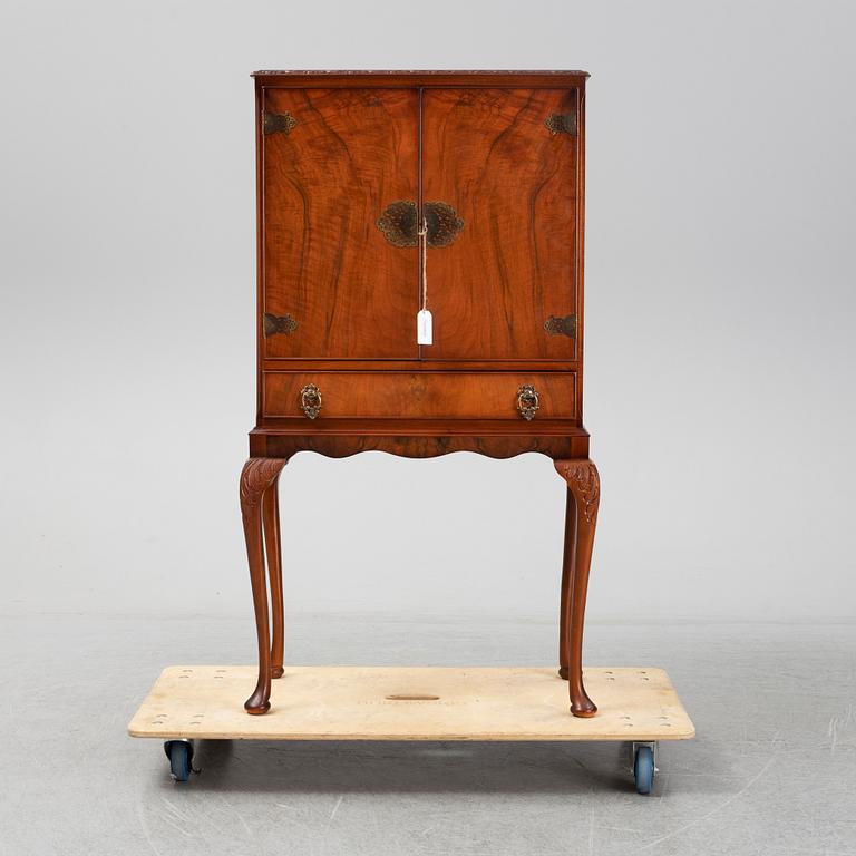 A mid 20th century walnut veneered bar cabinet.