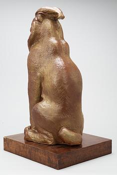 A Michael Schilkin stoneware sculpture of a seated lynx, Arabia.