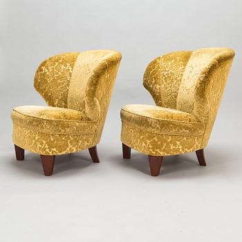 A pair of mid 20th century armchairs.