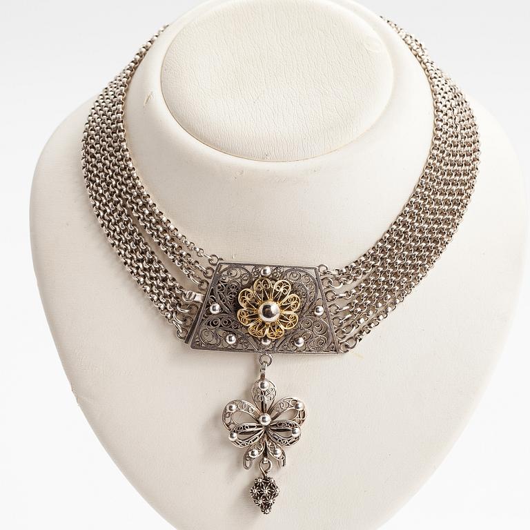 A silver necklace.