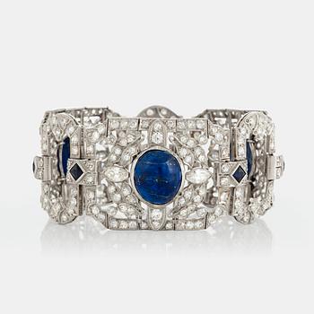 1005. A platinum bracelet set with lapis lazuli, old-cut diamonds with a total weight of ca 10 cts and synthetic sapphires.