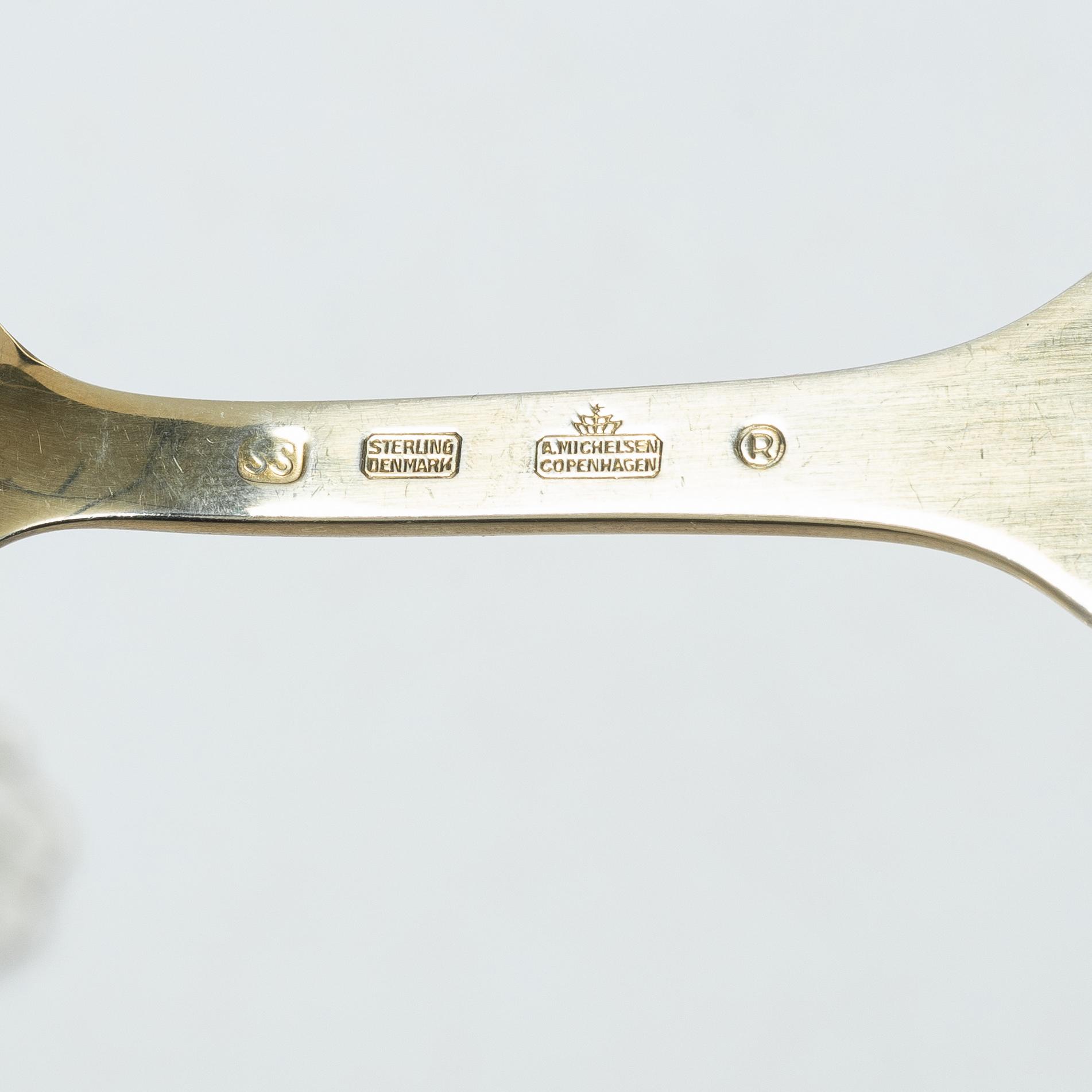 Anton Michelsen, Annual/Christmas flatware, 6 pieces, gilt sterling silver and enamel, Denmark, 1950s.