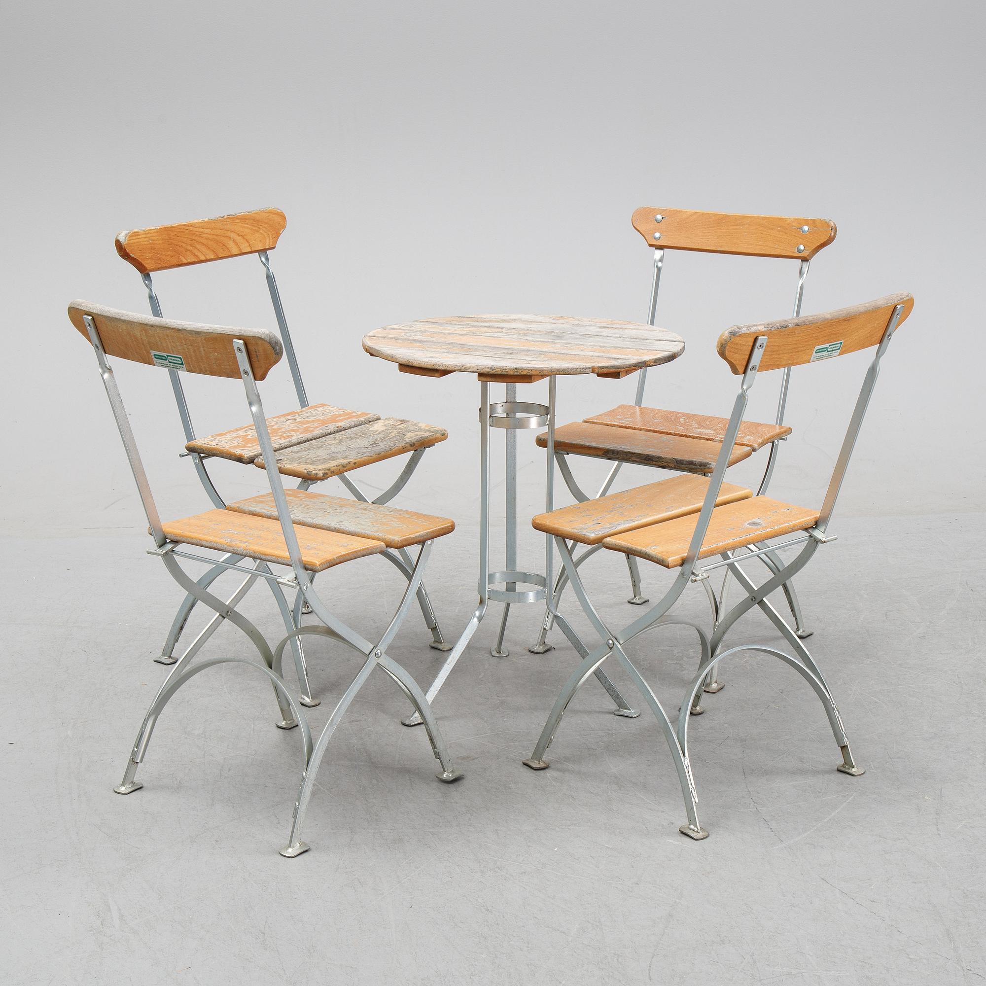 A set of four chairs and one table, Grythyttan, late 20th century.