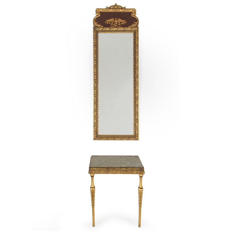 a bronzed mirror and a console table from the second half of the 20th century.
