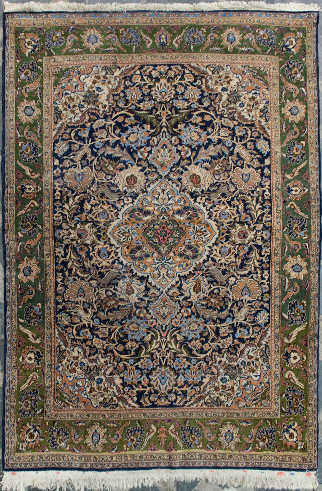 An oriental carpet. Qum. Circa 201x140 cm.
