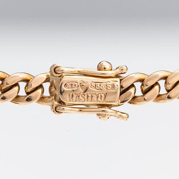 Necklace, cross, 18K/14K gold with diamonds totaling approx. 0.55 ct, Finland 1971/2007.