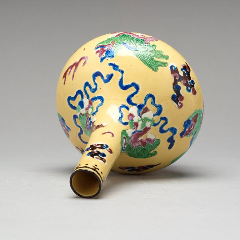 A yellow glazed vase with buddhist lions, Qing dynasty, 19th Century.