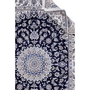 A carpet, Nain, part silk, ca 350 x 250 cm.