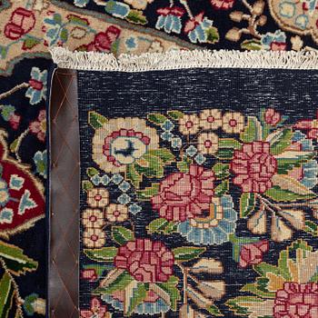 A carpet, semi-antique, Kerman, signed Rashid Farrokhi, ca 397 x 297 cm.