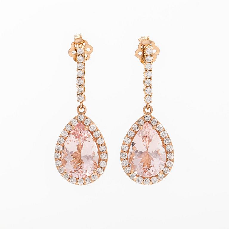 A pair of 18K gold earrings, with pear-cut morganites and diamonds.