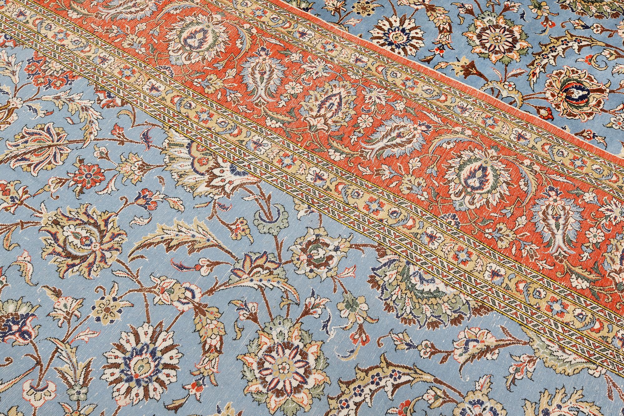 A Ghom carpet, part silk, approx. 480 x 350 cm.