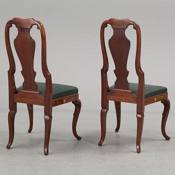 A pair of dutch rococo style chairs, first half of the 29th century.