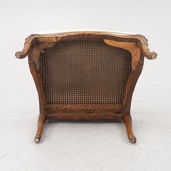 A French Louis XV armchair, mid 18th century.