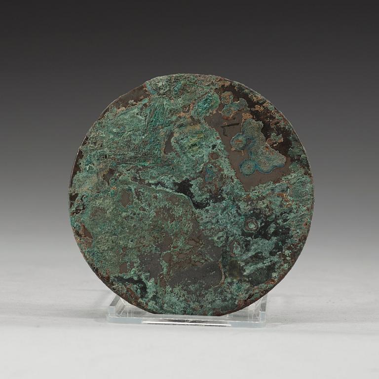 A bronze mirror decorated with flying birds, Tang dynasty (618-907).